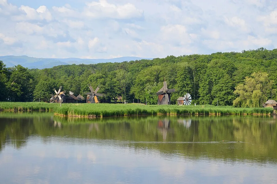Sibiu historic centre context image 4: Windmills across Lake Dumbrava at ASTRA open-air museum.