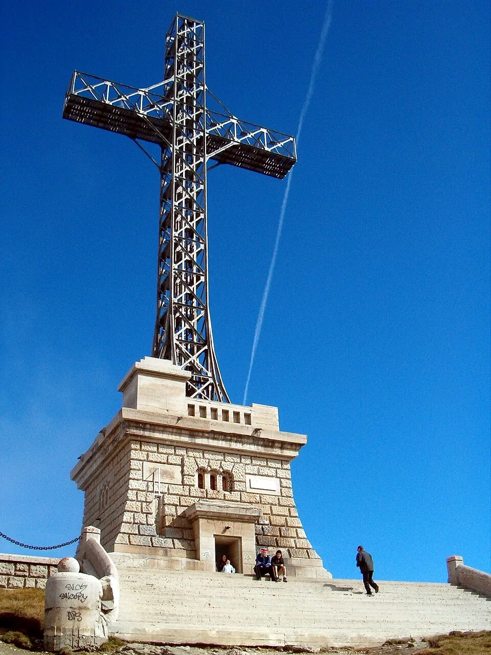 The tall steel Heroes' Cross monument standing on the Caraiman ridge, high above the Prahova Valley.